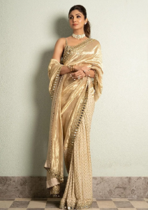 Shilpa Shetty wore an Arpita Mehta creation consisting of a gold tissue and a georgette sari